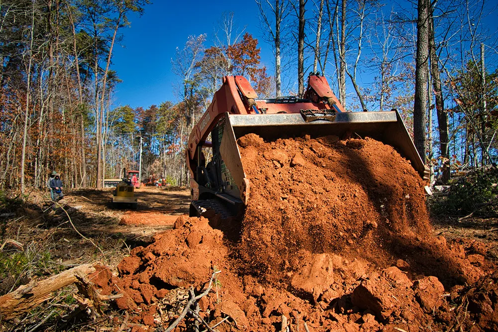 Machinery clearing vegetation